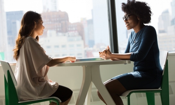 One woman interviewing another