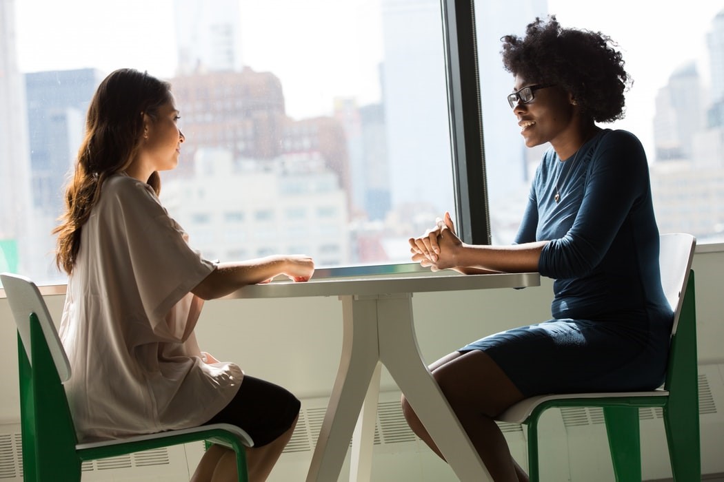 One woman interviewing another