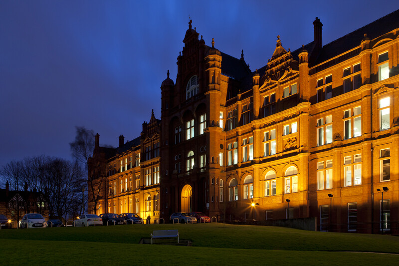 Peel building against a dark sunset