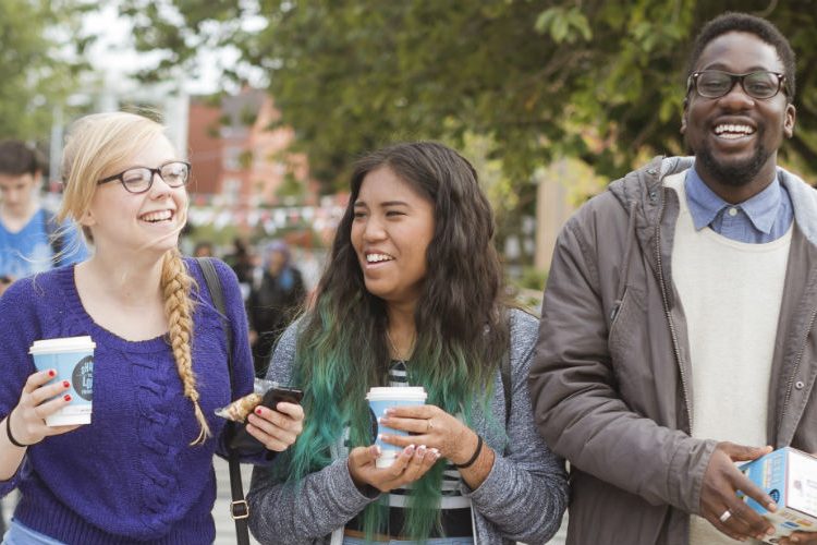 3 students at an open day