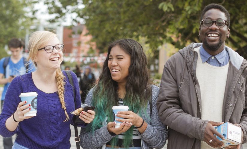 3 students at an open day