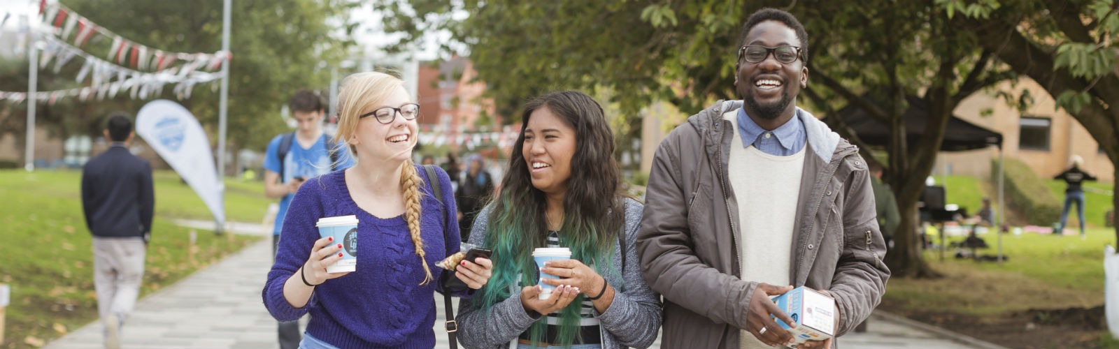 3 students at an open day