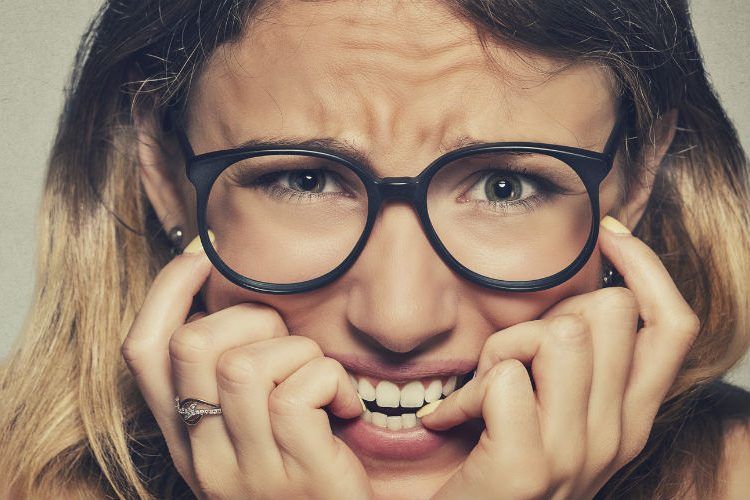 Young woman looking anxious