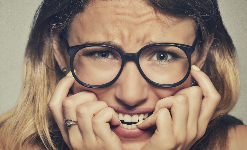 Young woman looking anxious