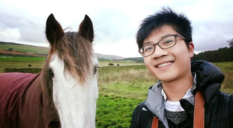 Harry with a horse in the countryside