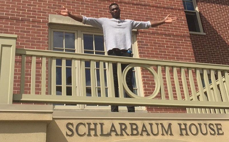 Emmanuel standing above his student halls