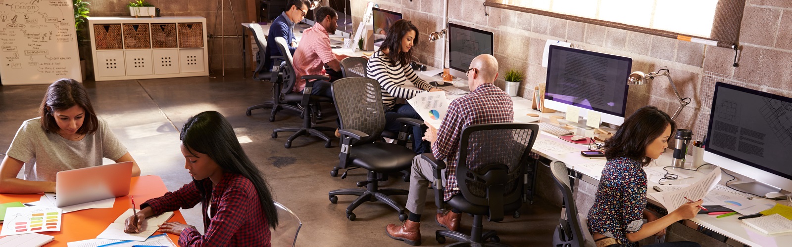 Image: a group of people working in an office