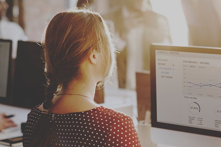 Image of a young woman at a computer