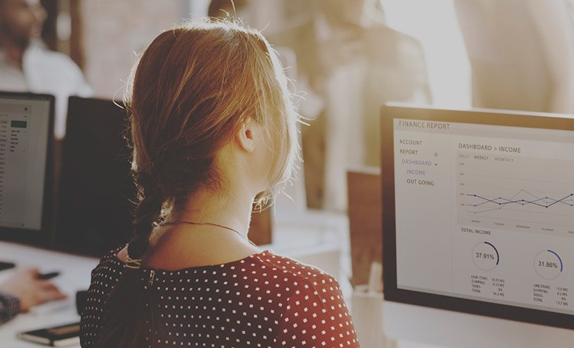 Image of a young woman at a computer