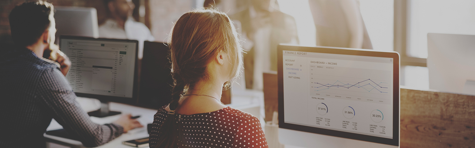 Image of a young woman at a computer