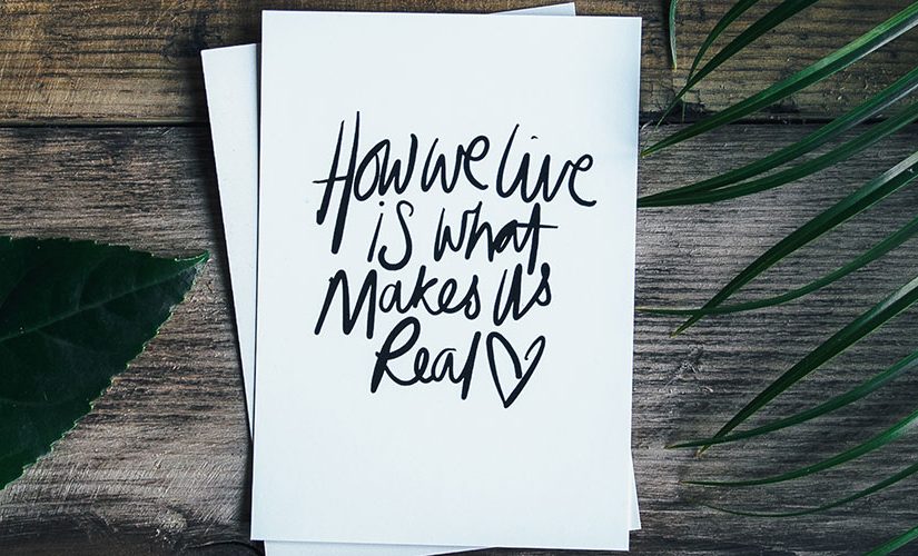 Image: Card with "How we live is what makes us real" text