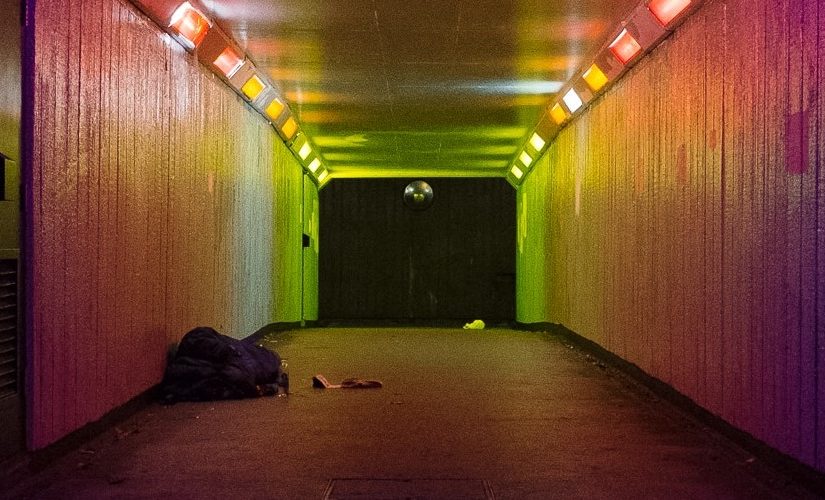 Image: subway with a rough sleeper at the far end