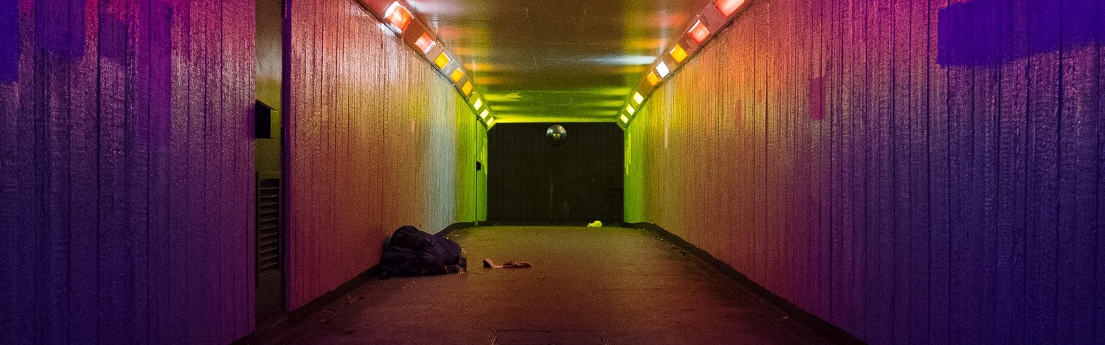 Image: subway with a rough sleeper at the far end