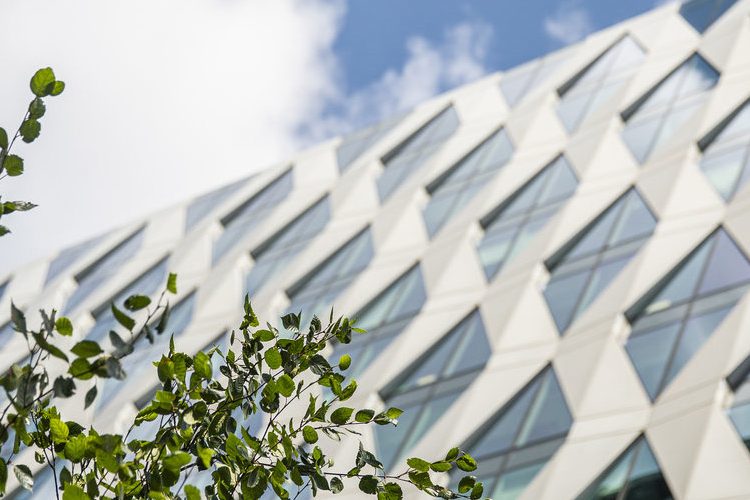 A shot of a building in MediaCityUK, the sky is clear and blue.