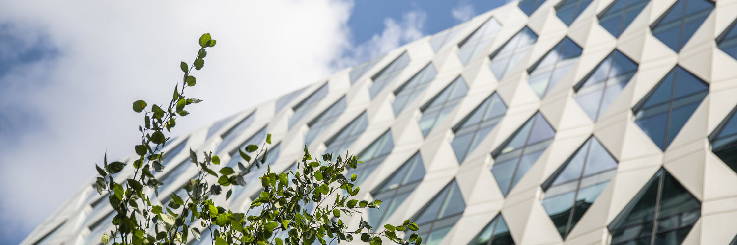 A shot of a building in MediaCityUK, the sky is clear and blue.