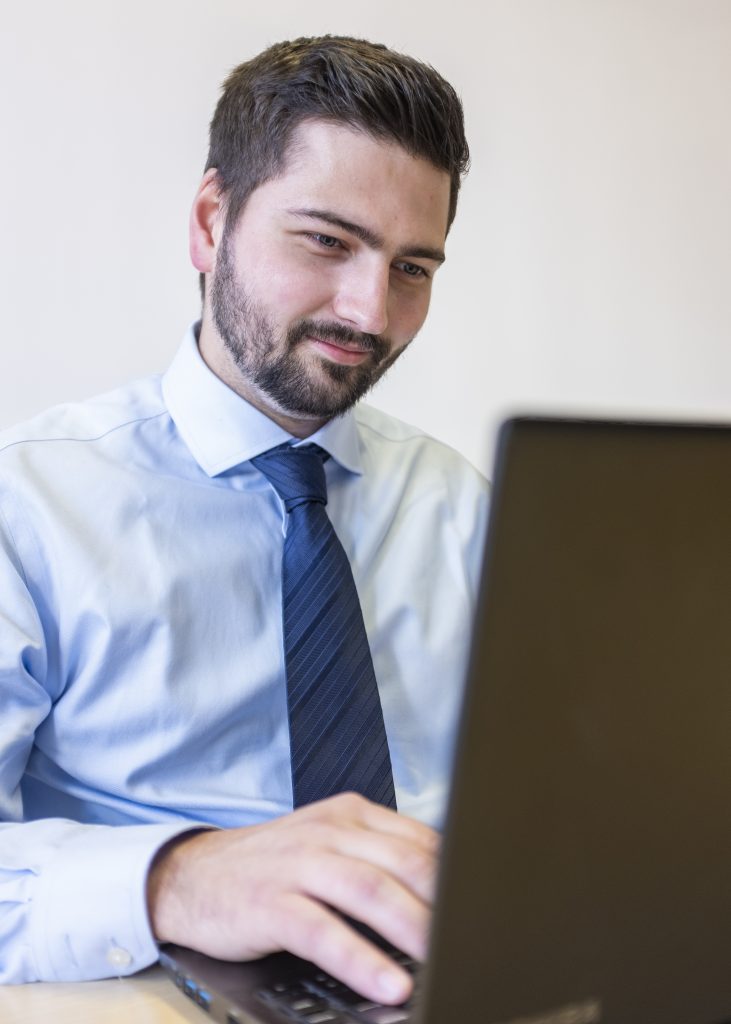 James Hodgson-Jones sat at his laptop 