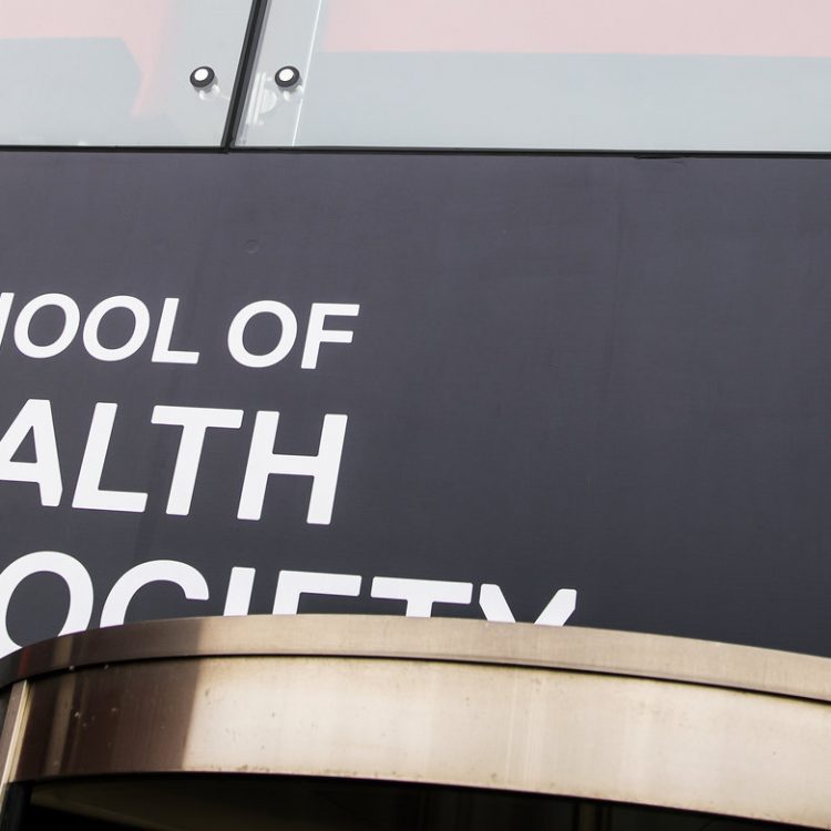 Photo of Health and Society banner infront of mary seacole building