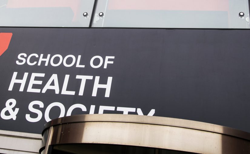 Photo of Health and Society banner infront of mary seacole building