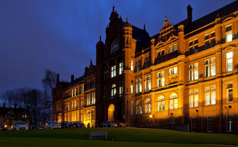 Photo of the Peel Building at night with lights on