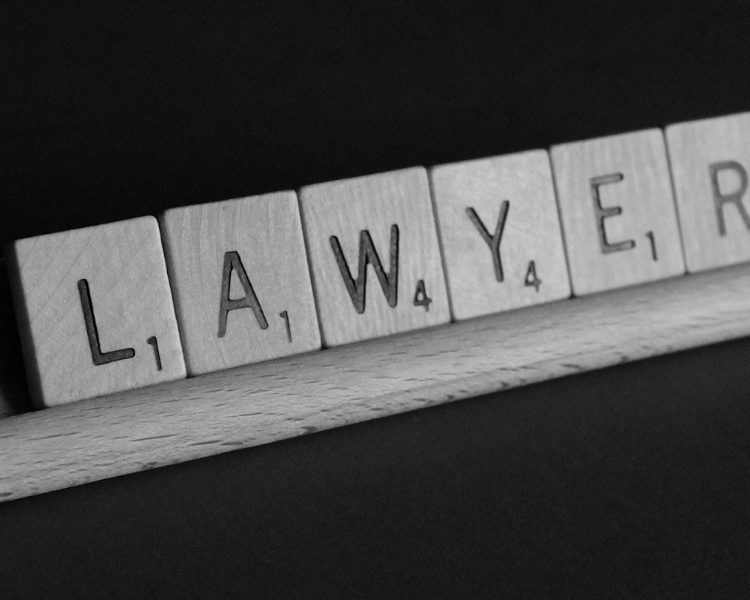 Image of the word "Lawyer" spelt out with scrabble pieces