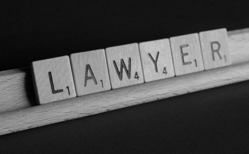 Image of the word "Lawyer" spelt out with scrabble pieces