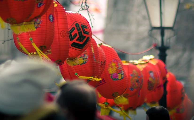 Photo of red lanterns in-between the street lamps