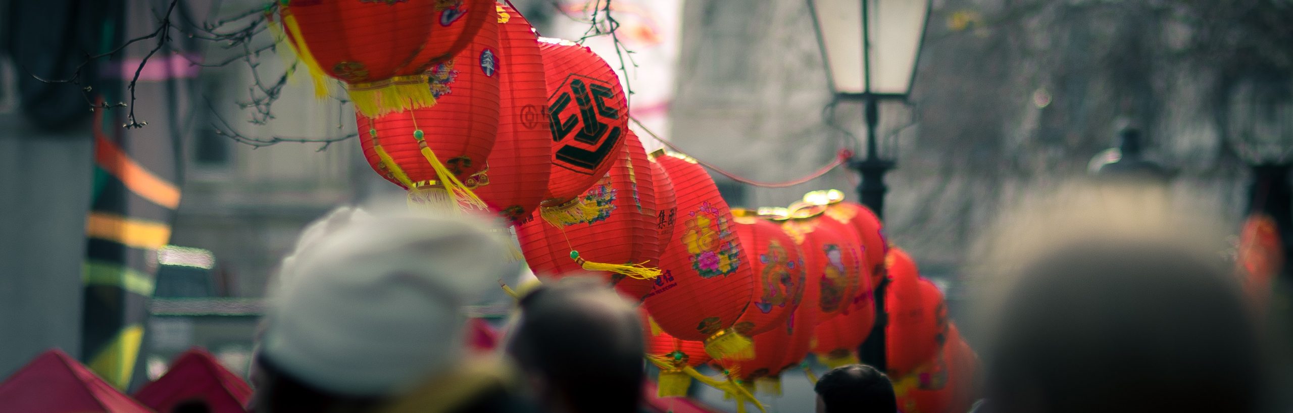 Photo of red lanterns in-between the street lamps