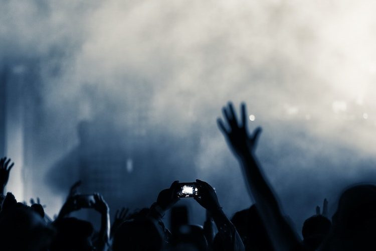 Photo of people raising their hands