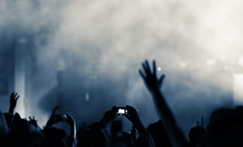 Photo of people raising their hands