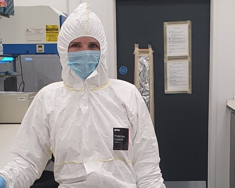 Photo of Holly Broadhurst fully covered with protective suits, masks and gloves