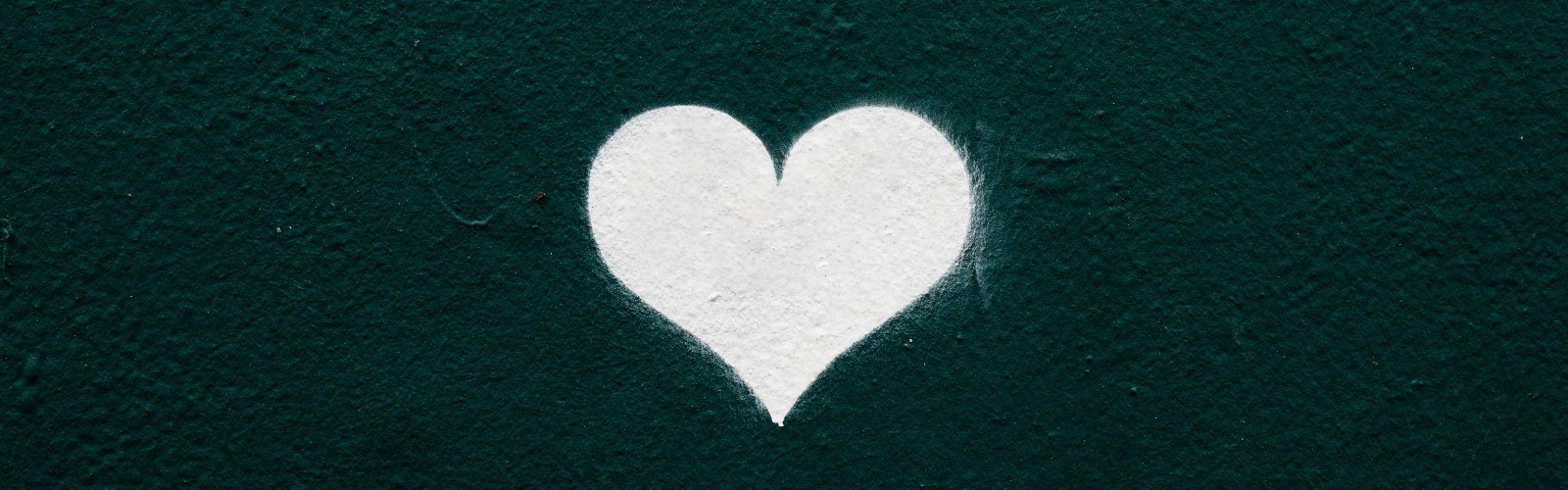 Image of white chalk heart on a dark background