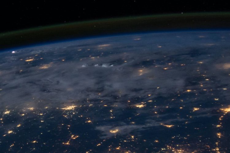 Photo of earth from space during night with city lights