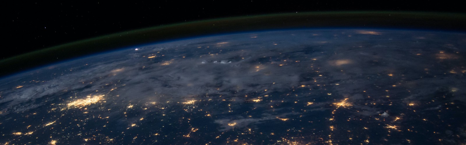 Photo of earth from space during night with city lights