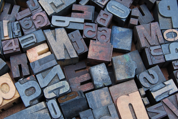 Photo of different letters in wood stamp