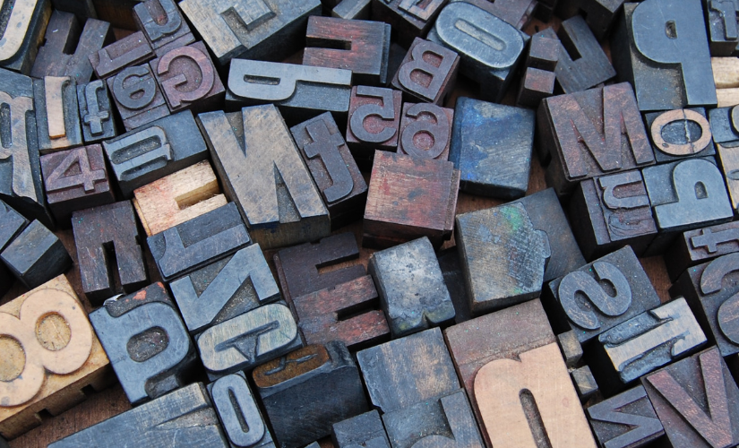 Photo of different letters in wood stamp