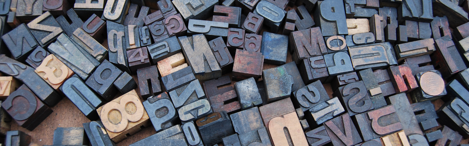 Photo of different letters in wood stamp