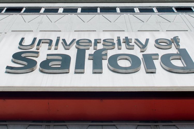 Close up photograph of the University of Salford sign on Maxwell Building