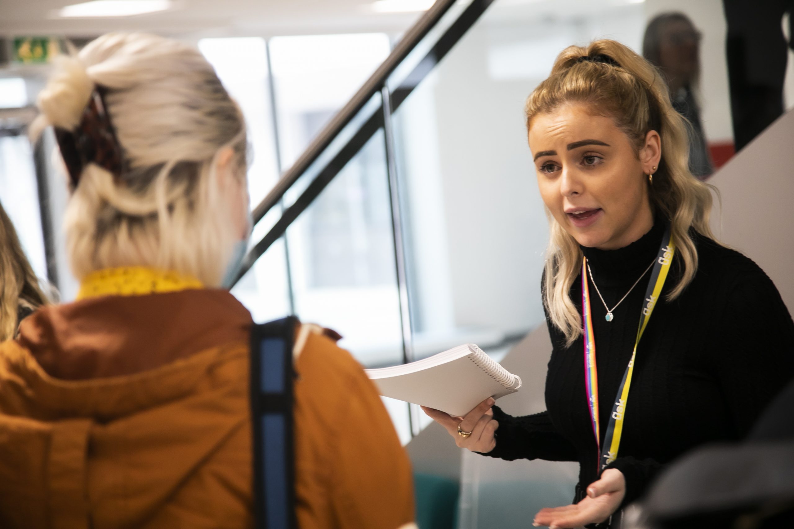 A Careers Adviser talking to students at a Careers Fair