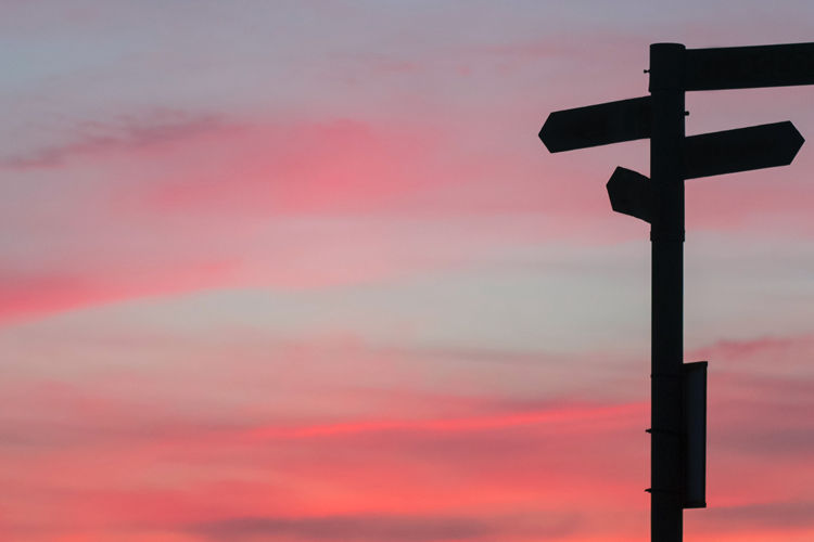 Cross roads with a red sky in the background