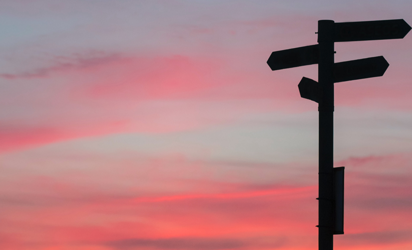 Cross roads with a red sky in the background