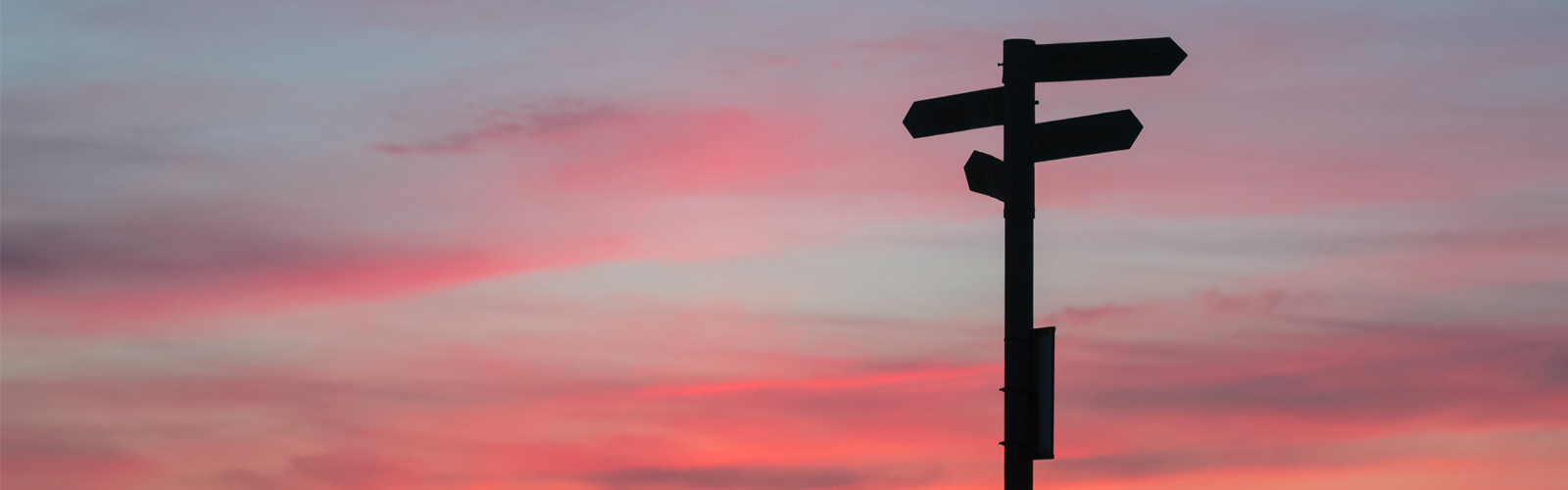 Cross roads with a red sky in the background