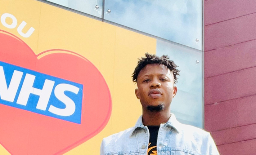 Cropped Photo of a man standing infront of the Mary Seacole Building