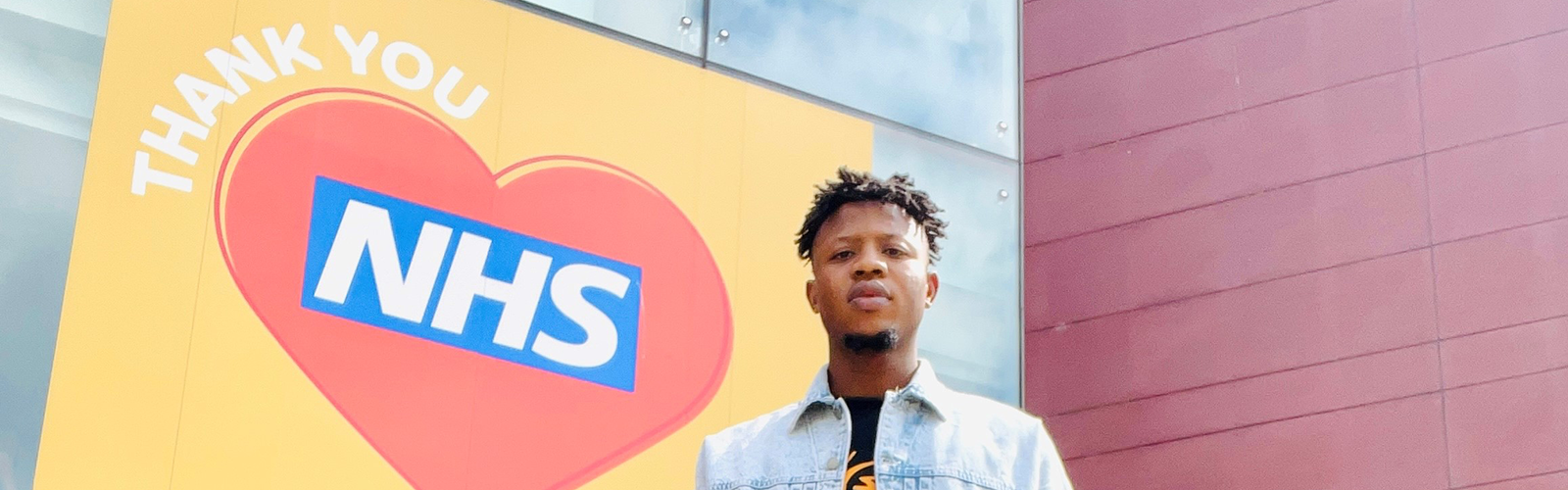 Cropped Photo of a man standing infront of the Mary Seacole Building