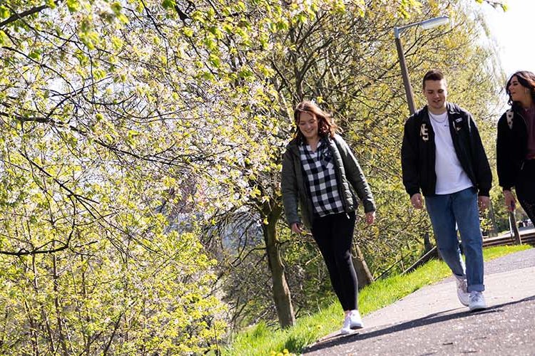 Students walking on Peel Park campus