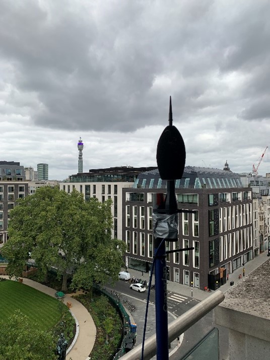 Image of a mic being tested on top of a building