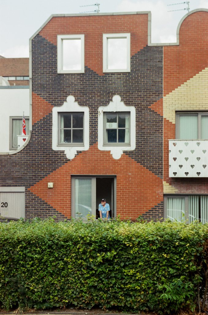 Photo of City fan looking out of the window around the New Islington neighbourhood