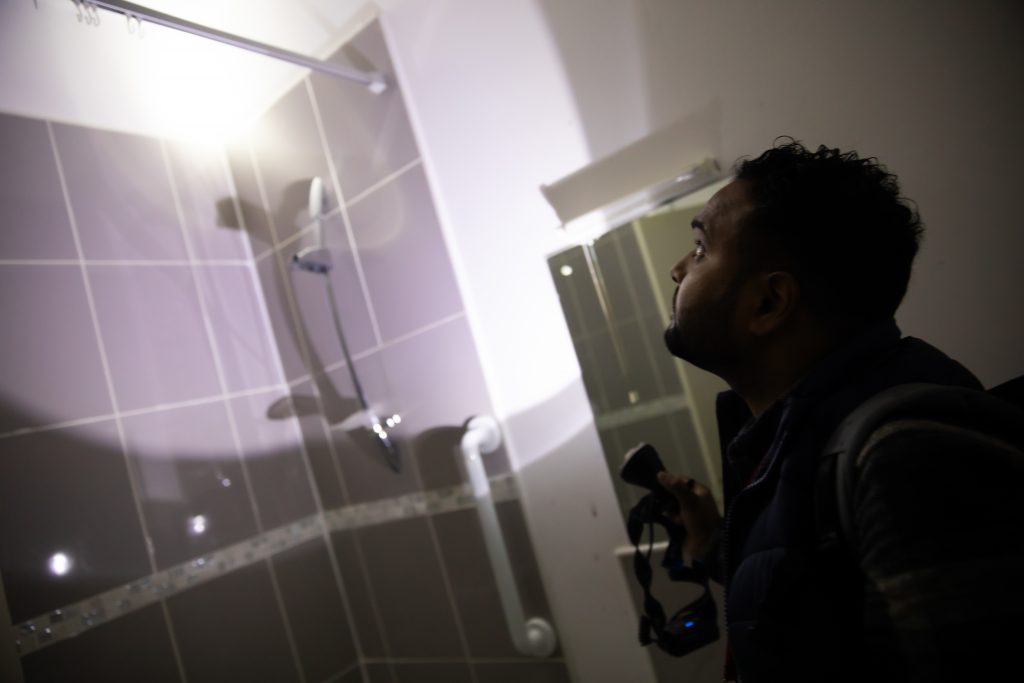 Salford student inspecting a home on a site visit 