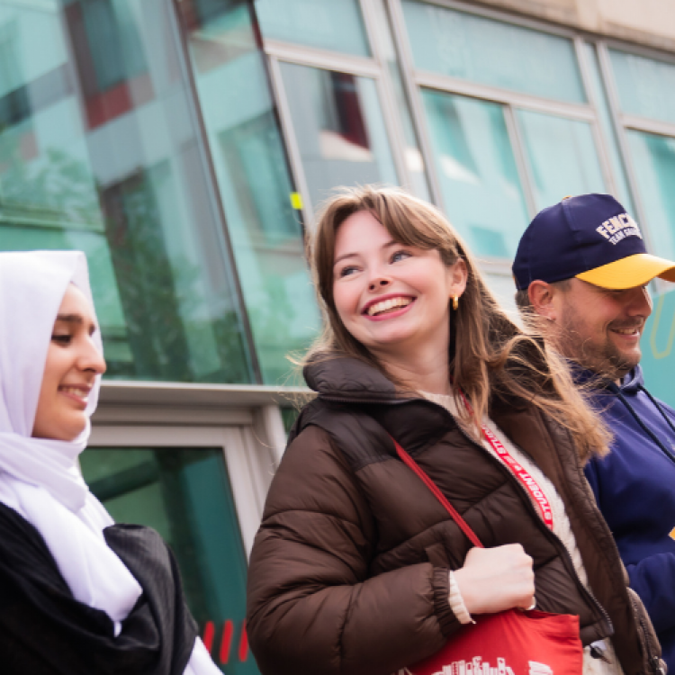 Four students leaving University House on Peel Park campus