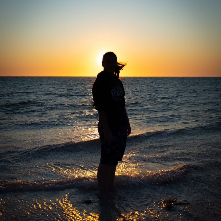 Sevim at the beach during sunset