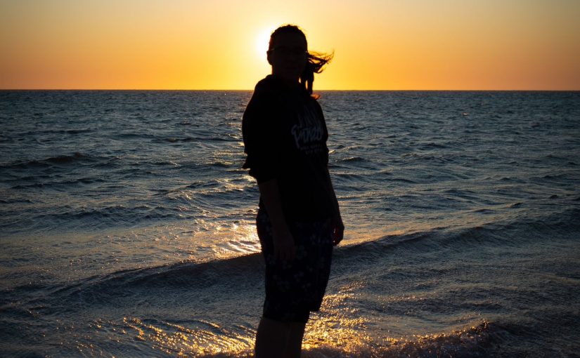 Sevim at the beach during sunset